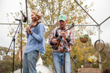 CL File Photo by Kate Lamb. Cutline - There were many bluegrass bands that played throughout the day. These are two members from Sourwood Honey who didn't seem to mind the windy cold.